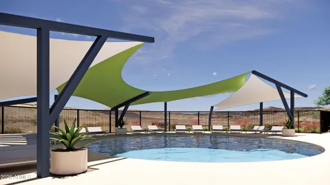 a view of a house with swimming pool and sitting area