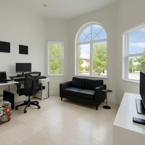 a living room with furniture and a window