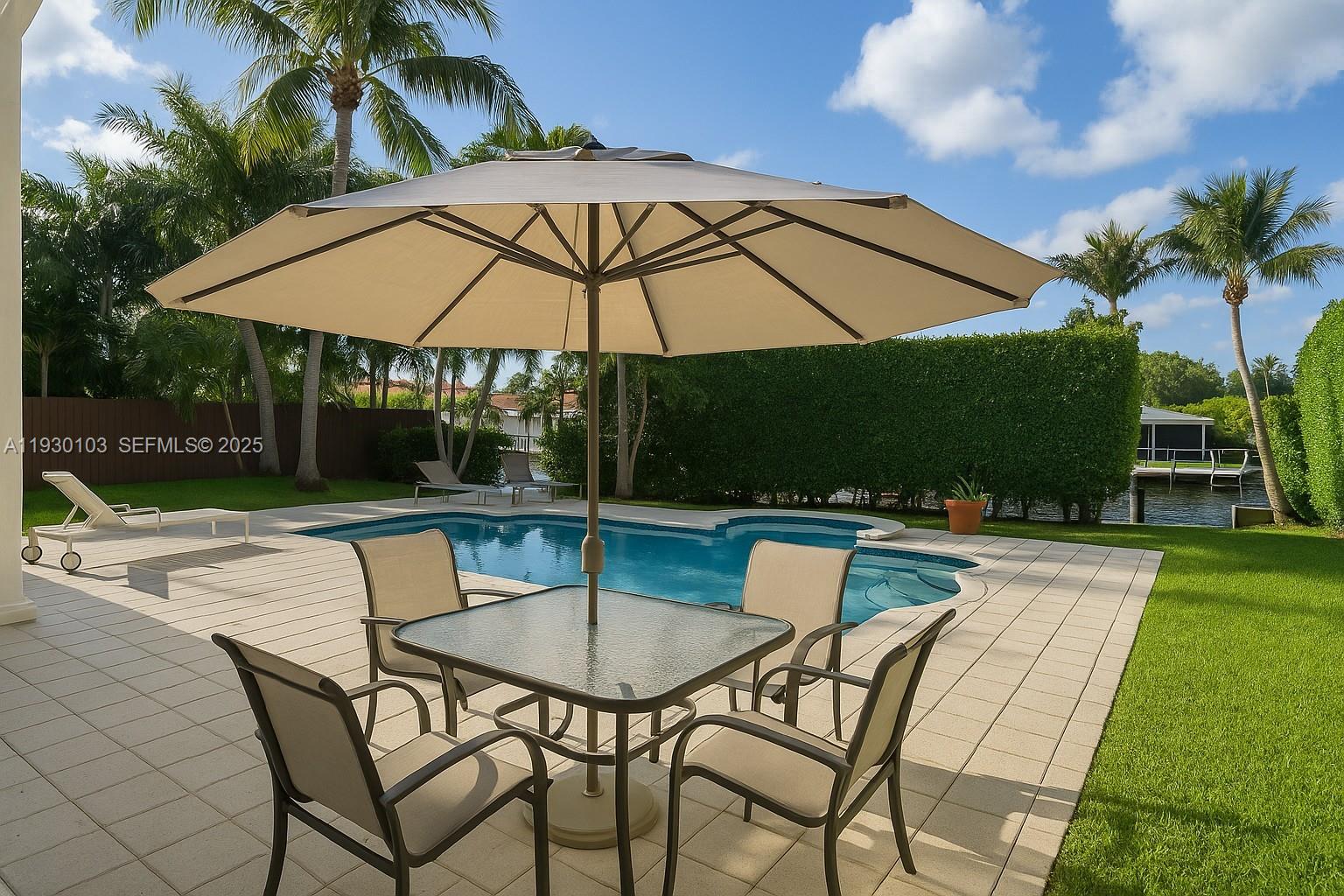 1490 Cleveland Road Miami Beach, FL 33141 - Photo 17 of 22 a swimming pool with outdoor seating and yard