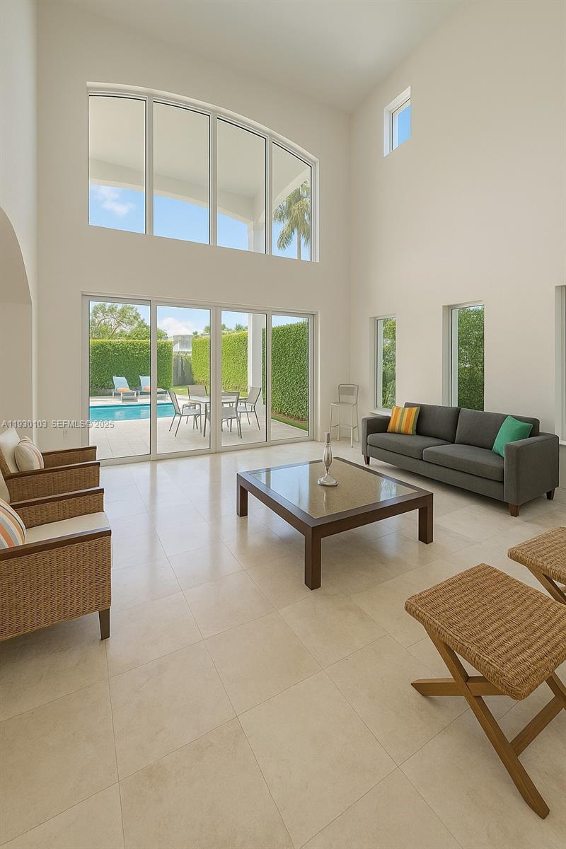 1490 Cleveland Road Miami Beach, FL 33141 - Photo 18 of 22 a living room with furniture and a floor to ceiling window