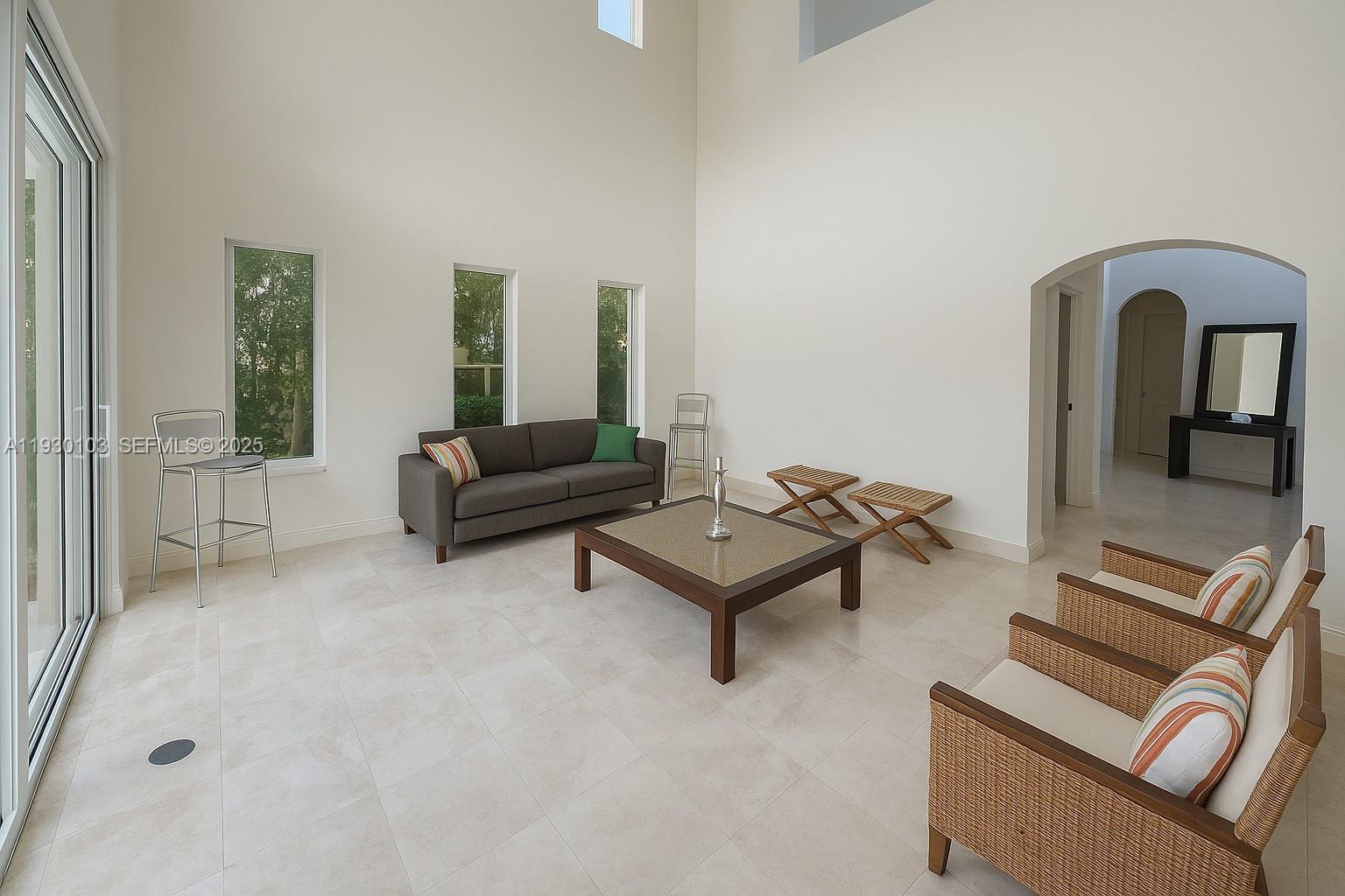 1490 Cleveland Road Miami Beach, FL 33141 - Photo 19 of 22 a living room with furniture and a window