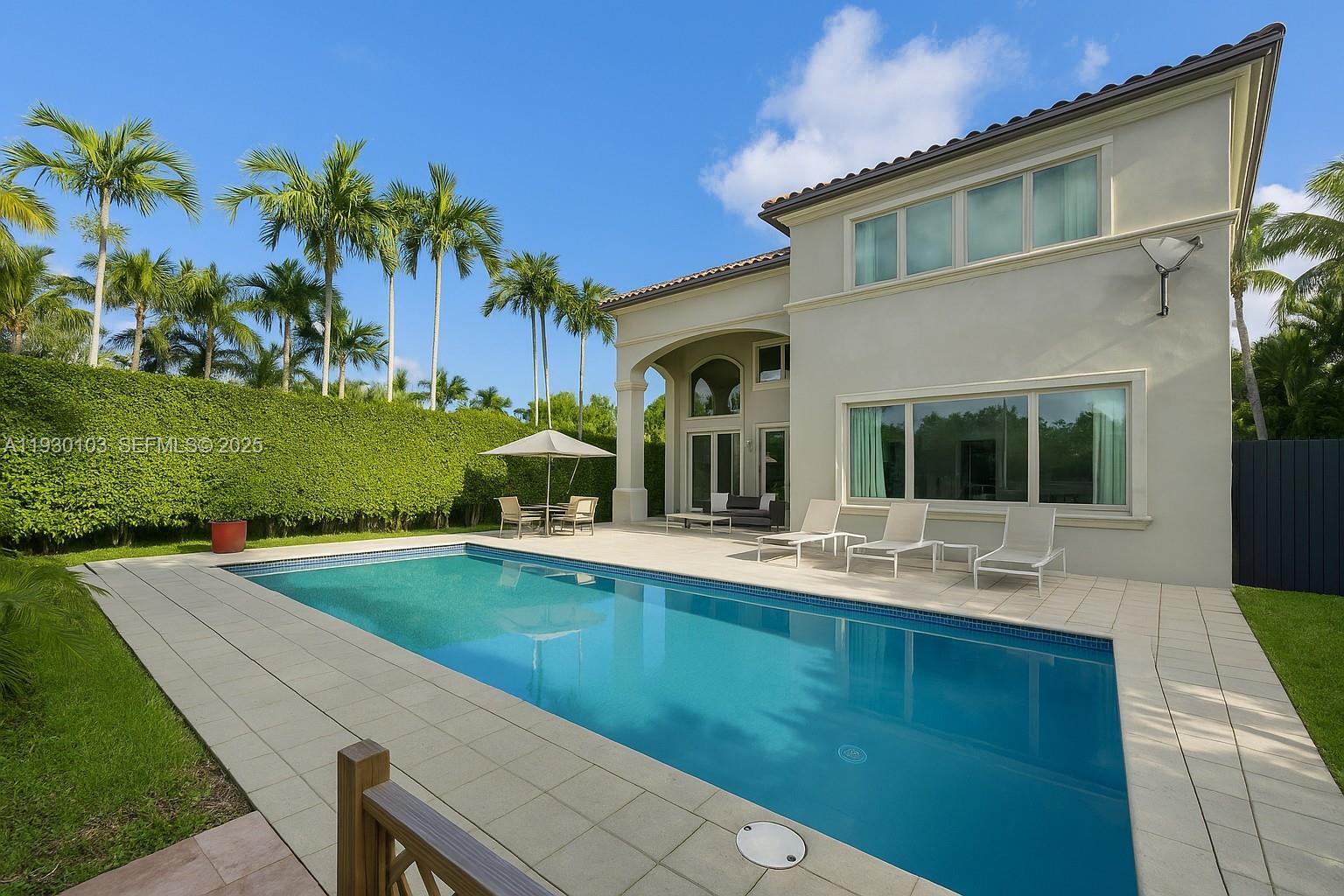 1490 Cleveland Road Miami Beach, FL 33141 - Photo 2 of 22 a front view of a house with garden