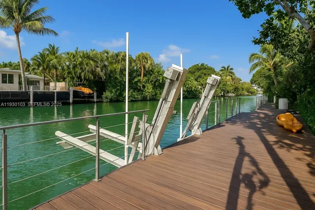 a view of a swimming pool with a patio and a garden