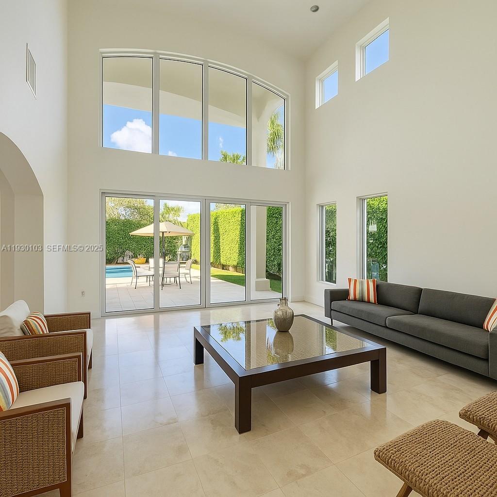 1490 Cleveland Road Miami Beach, FL 33141 - Photo 6 of 22 a living room with furniture and a large window