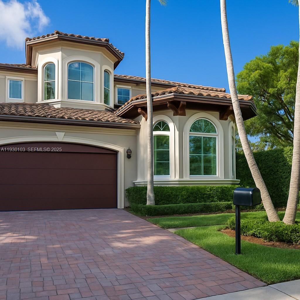1490 Cleveland Road Miami Beach, FL 33141 - Photo 9 of 22 a front view of a house with a garden