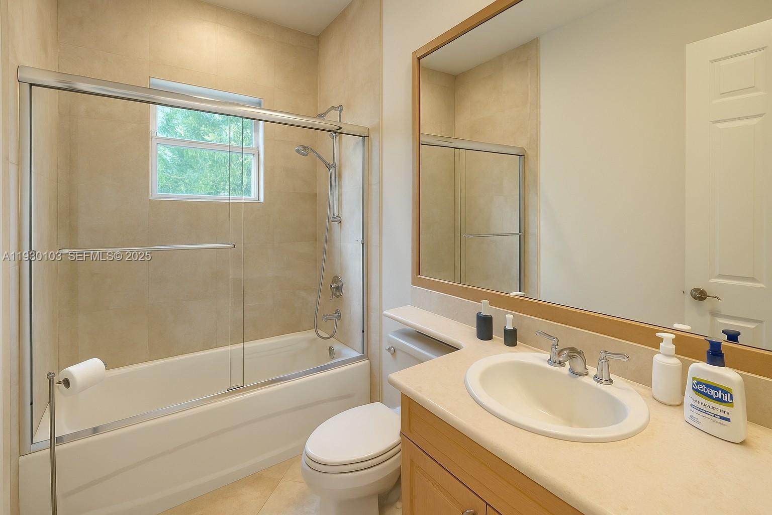 1490 Cleveland Road Miami Beach, FL 33141 - Photo 10 of 22 a bathroom with a sink a toilet and shower