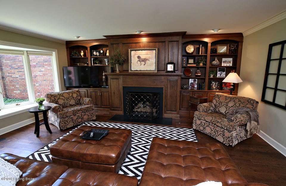 Great Room overlooks patio & views & features a paneled fireplace!