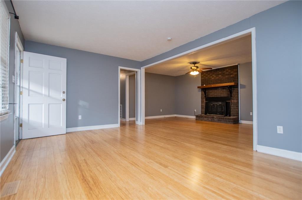 5166 Liberty Road Villa Rica, GA 30180 - Photo 14 of 52 a view of an empty room with wooden floor and a window