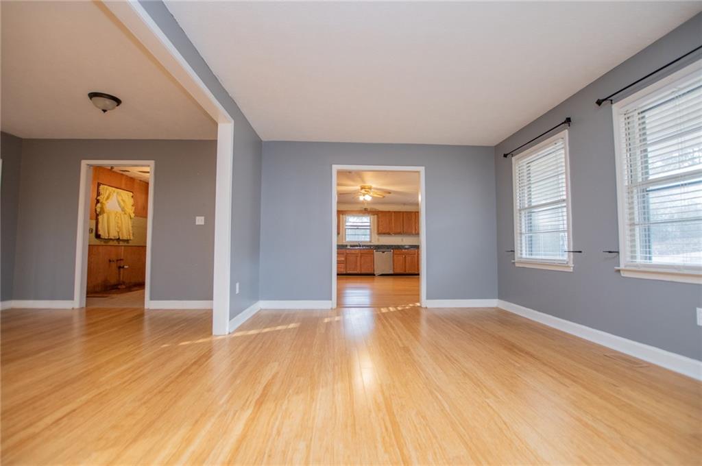5166 Liberty Road Villa Rica, GA 30180 - Photo 18 of 52 an empty room with wooden floor and windows