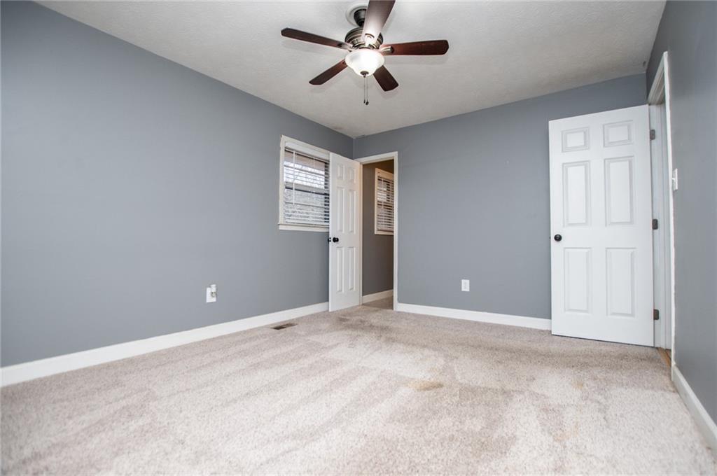 5166 Liberty Road Villa Rica, GA 30180 - Photo 30 of 52 a view of an empty room and a ceiling fan