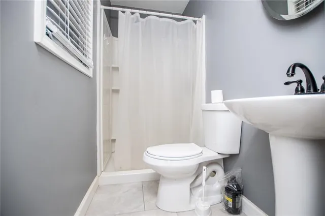 a bathroom with a toilet and a sink