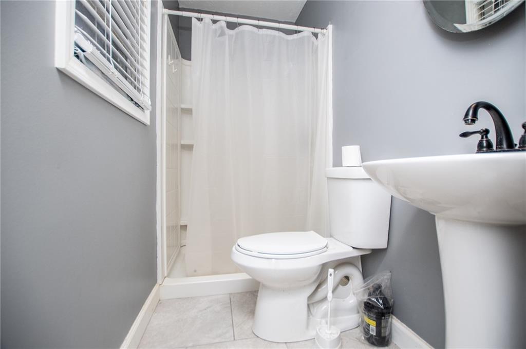 5166 Liberty Road Villa Rica, GA 30180 - Photo 32 of 52 a bathroom with a toilet and a sink