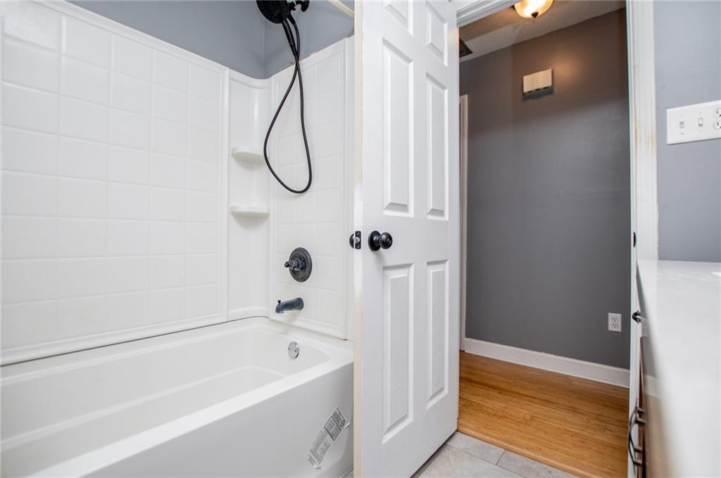 5166 Liberty Road Villa Rica, GA 30180 - Photo 34 of 52 a bathroom with a bathtub and a shower