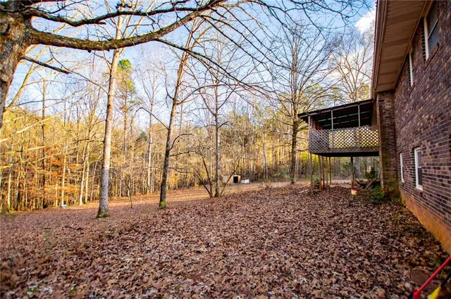 a backyard of a house with lots of green space