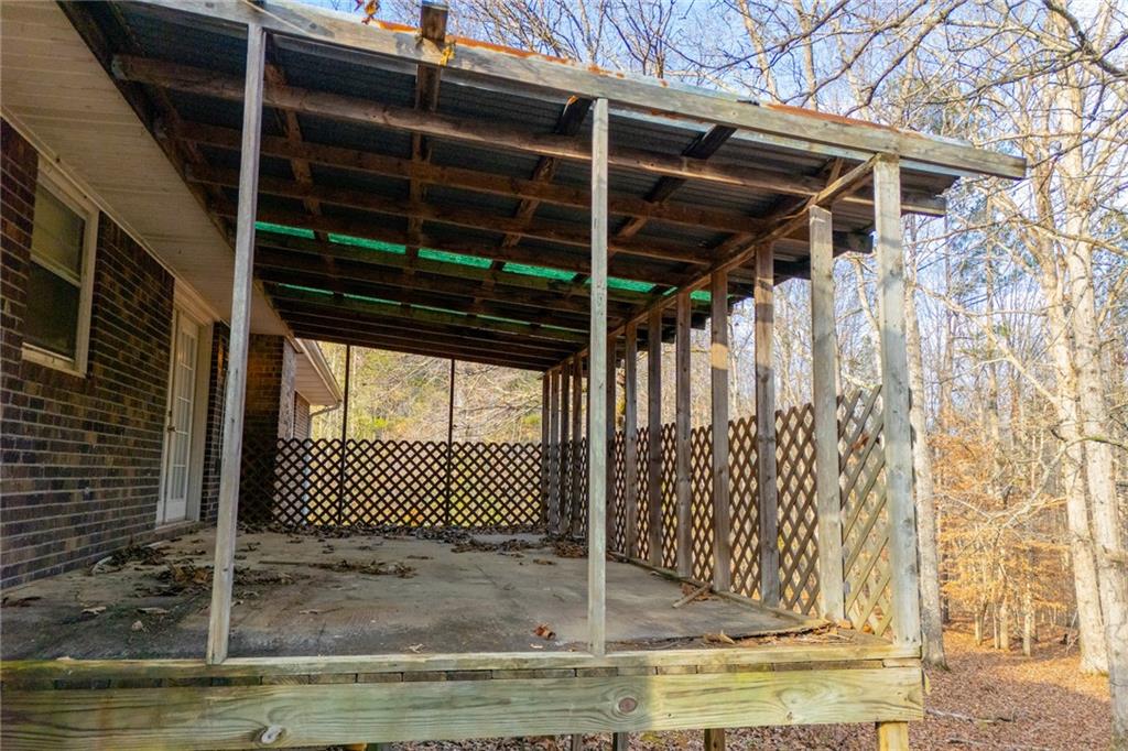 5166 Liberty Road Villa Rica, GA 30180 - Photo 51 of 52 a view of a garage with wooden floor and fence