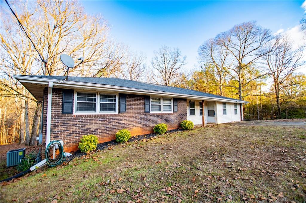 5166 Liberty Road Villa Rica, GA 30180 - Photo 6 of 52 a front view of a house with garden