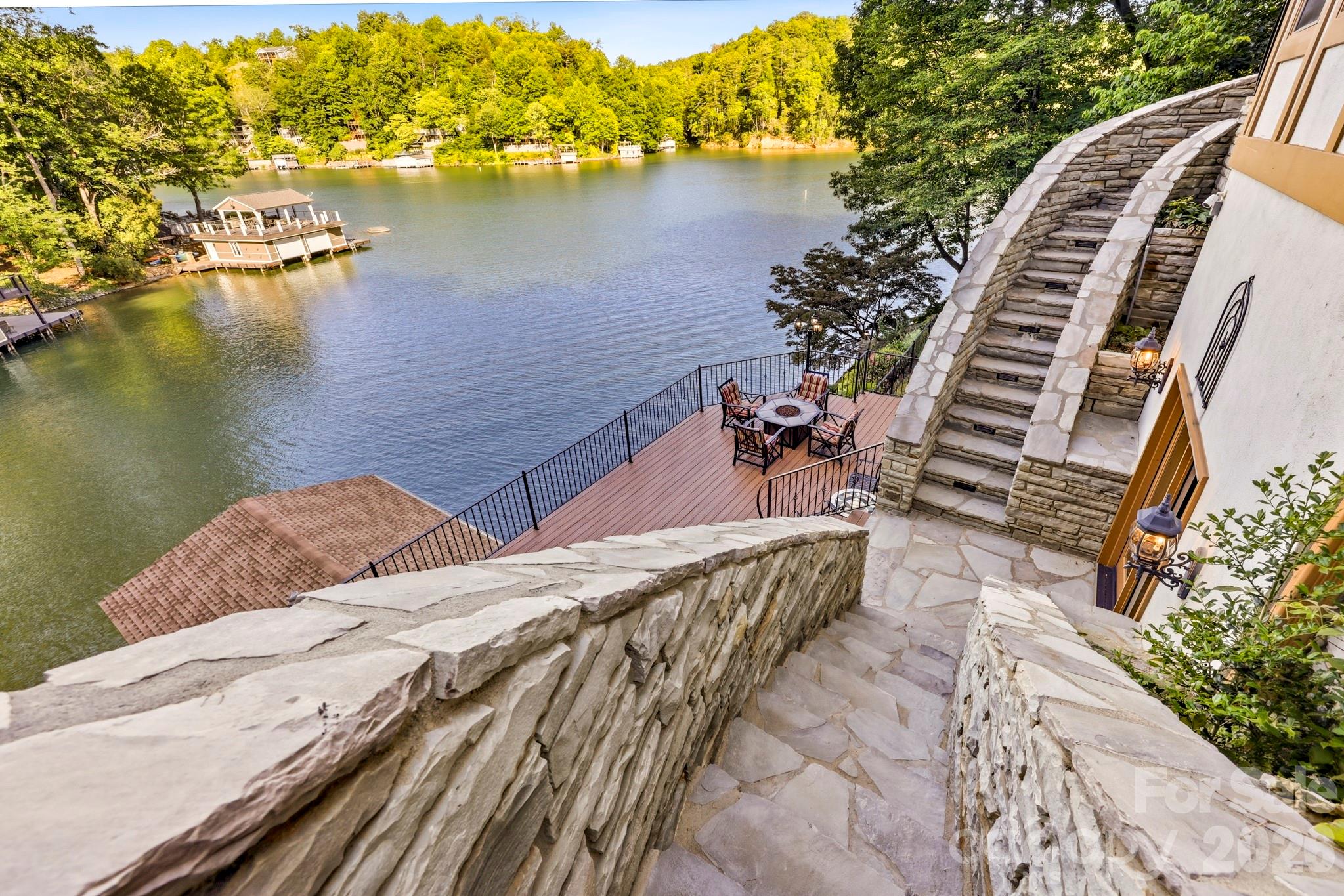 151 Garner Road Lake Lure, NC 28746 - Photo 35 of 48 a view of a lake with chairs