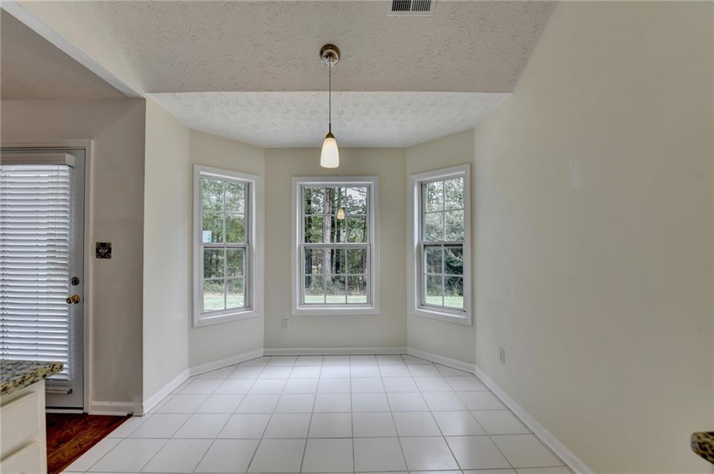 3555 Rivers End Place Buford, GA 30519 - Photo 17 of 49 a view of an empty room with a window