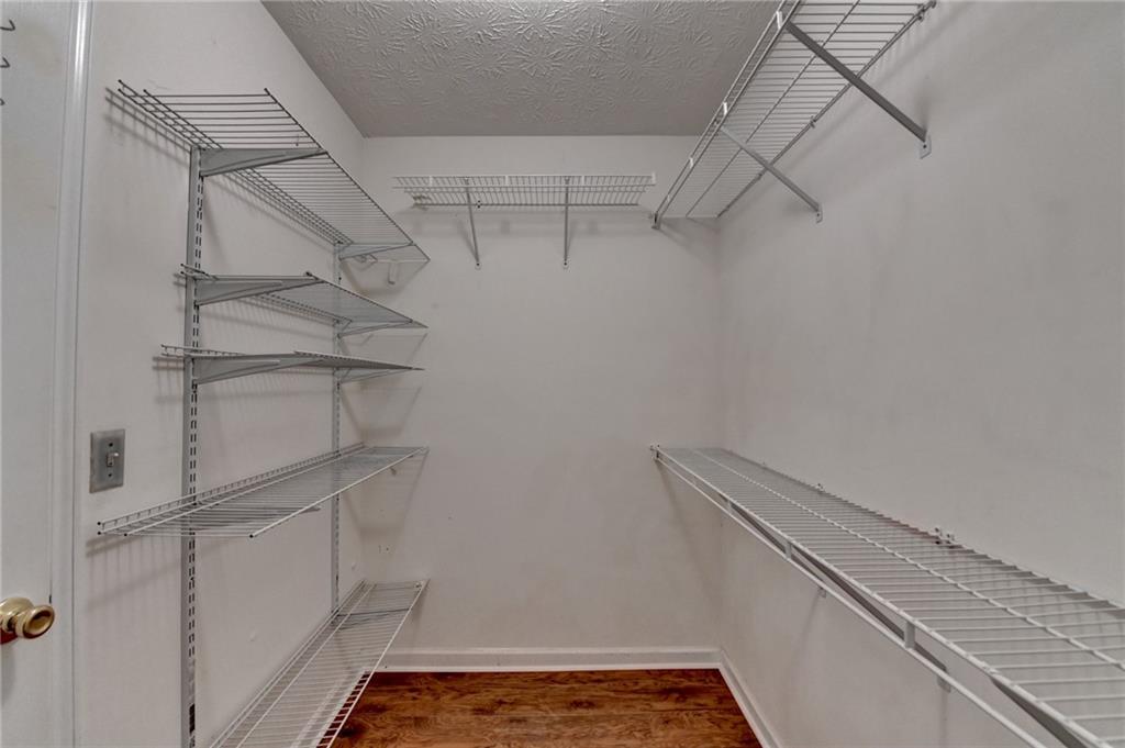 3555 Rivers End Place Buford, GA 30519 - Photo 30 of 49 a view of storage and utility room with racks on the wall