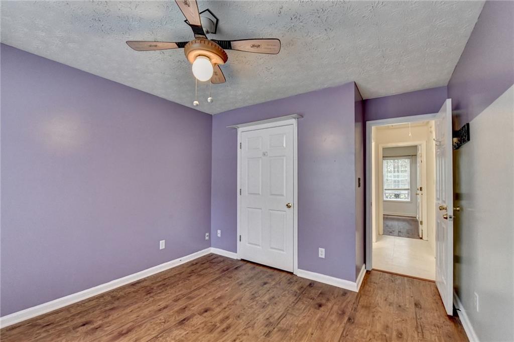 3555 Rivers End Place Buford, GA 30519 - Photo 35 of 49 a view of an empty room with closet and wooden floor
