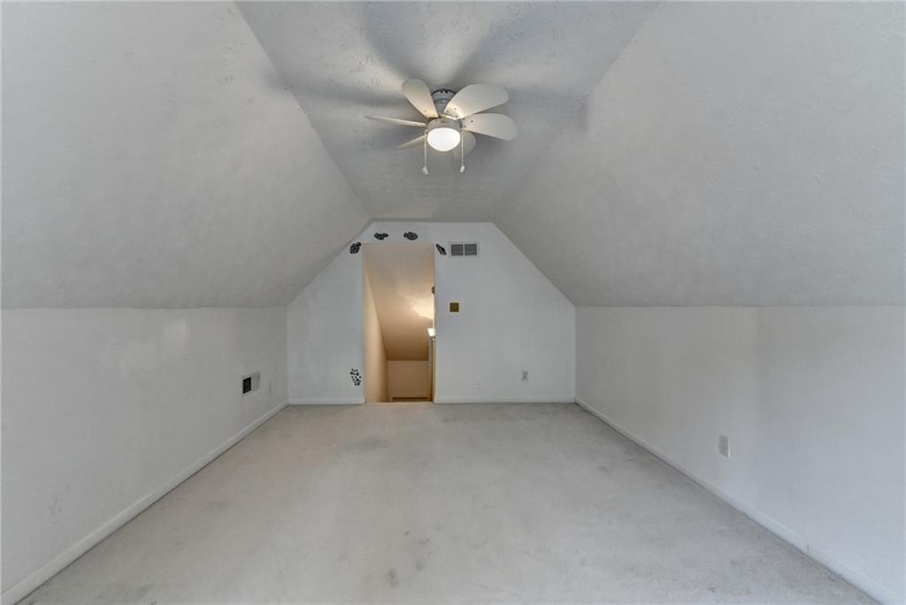 3555 Rivers End Place Buford, GA 30519 - Photo 43 of 49 a view of a livingroom with a ceiling fan and hardwood floor