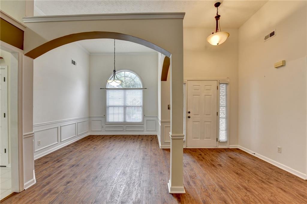 3555 Rivers End Place Buford, GA 30519 - Photo 5 of 49 a view of empty room with wooden floor and fan