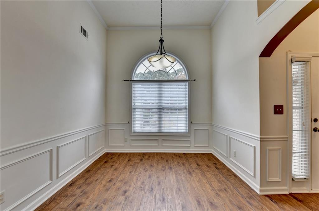 3555 Rivers End Place Buford, GA 30519 - Photo 6 of 49 an empty room with wooden floor and windows