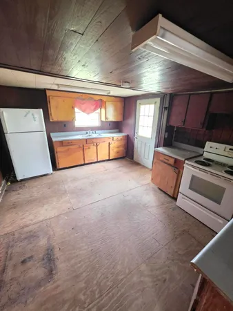 a kitchen with a stove and a microwave