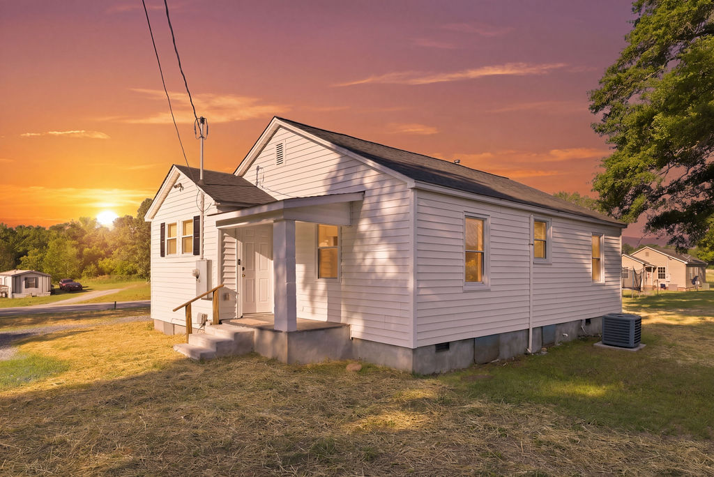 7604 Highway 252 Honea Path, SC 29654 - Photo 3 of 33 This cozy home is framed by a vibrant sunset, featuring classic siding and a welcoming front porch.