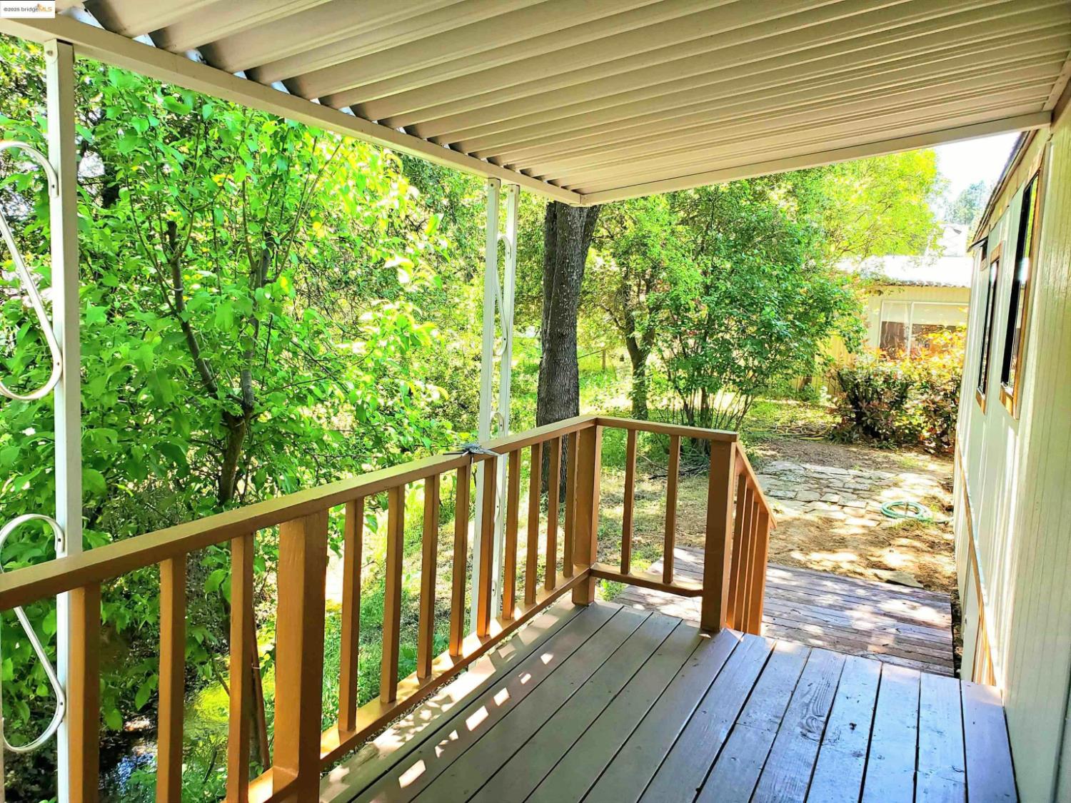 18330 Wards Ferry Road, Unit 59 Sonora, CA 95370 - Photo 4 of 10 a view of balcony with wooden floor