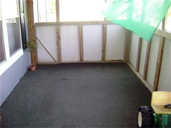 a view of a closet area with wooden floor