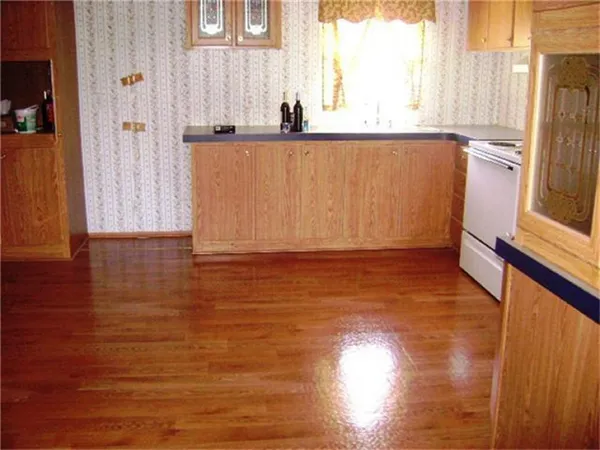 a view of bathroom with bathtub and wooden floor
