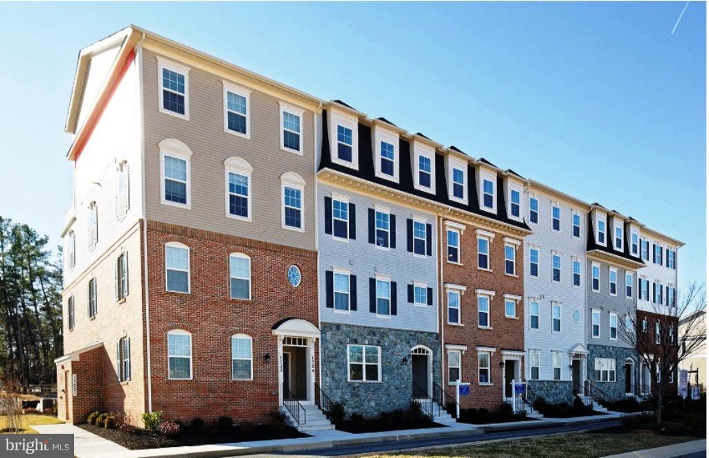1709 Fieldstone Court Hanover, MD 21076 - Photo 1 of 19 a front view of a building with garden