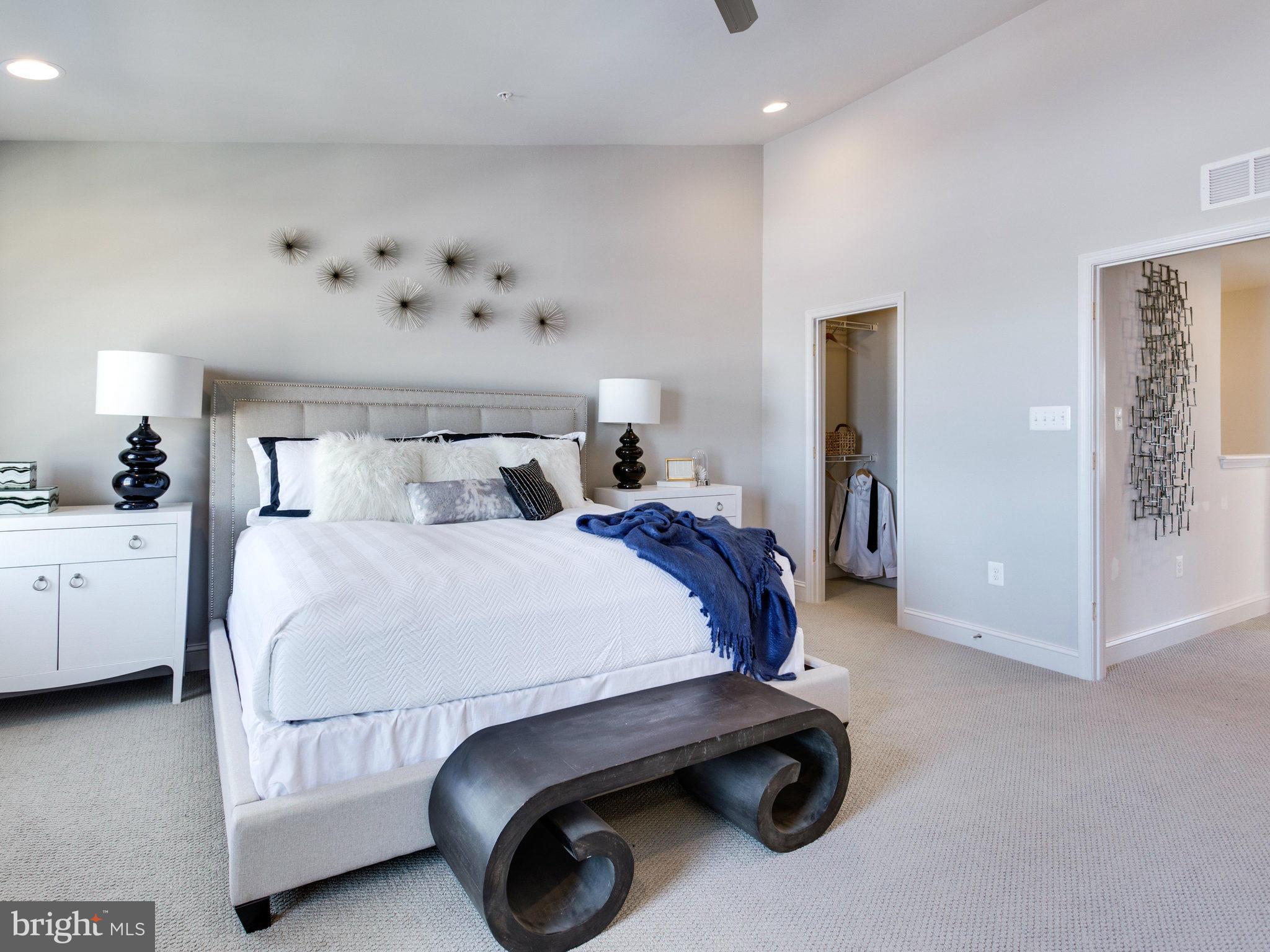 1709 Fieldstone Court Hanover, MD 21076 - Photo 15 of 19 a bed room with a bed and a chandelier