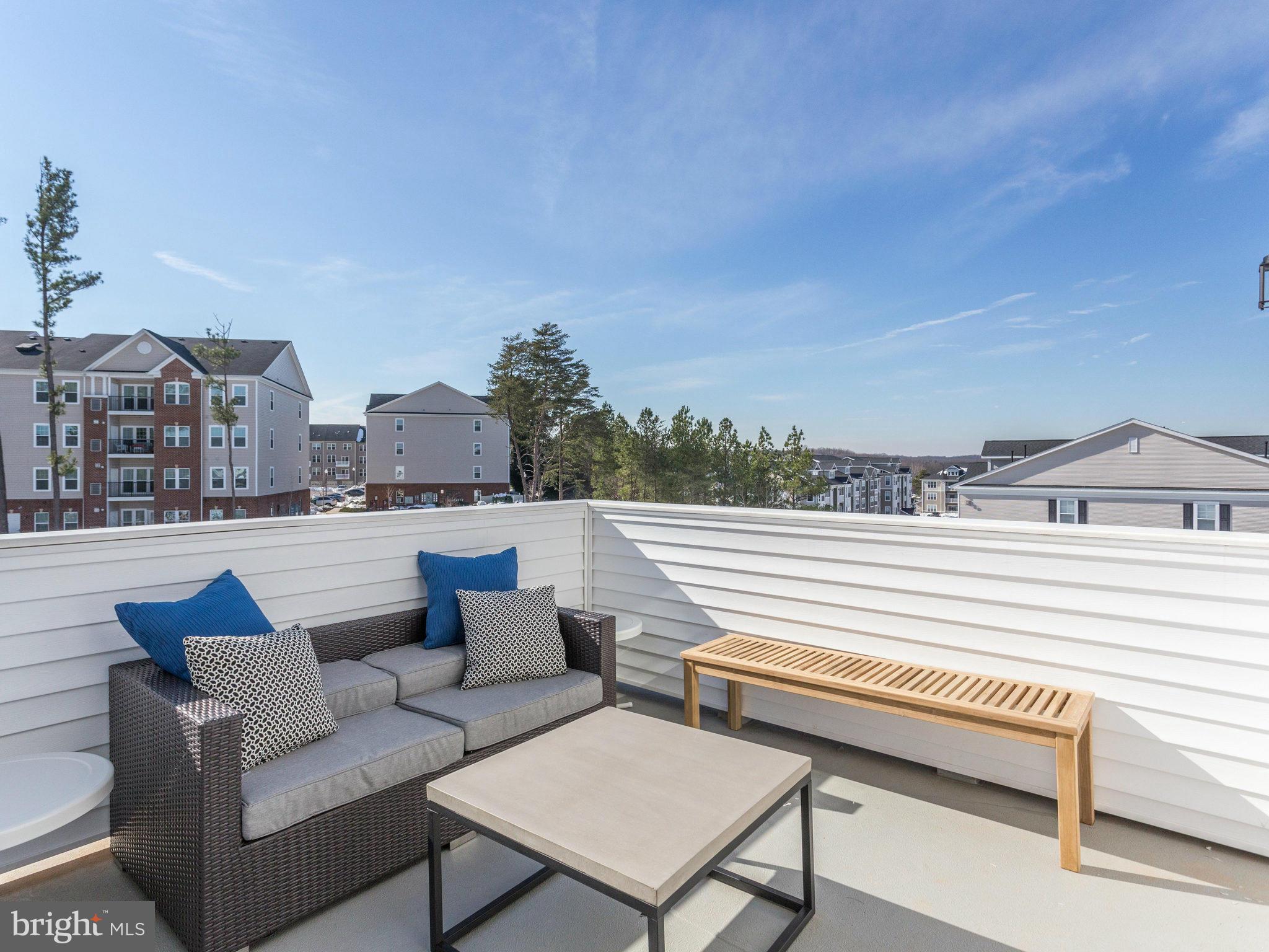 1709 Fieldstone Court Hanover, MD 21076 - Photo 18 of 19 a view of a terrace with couches and a potted plant