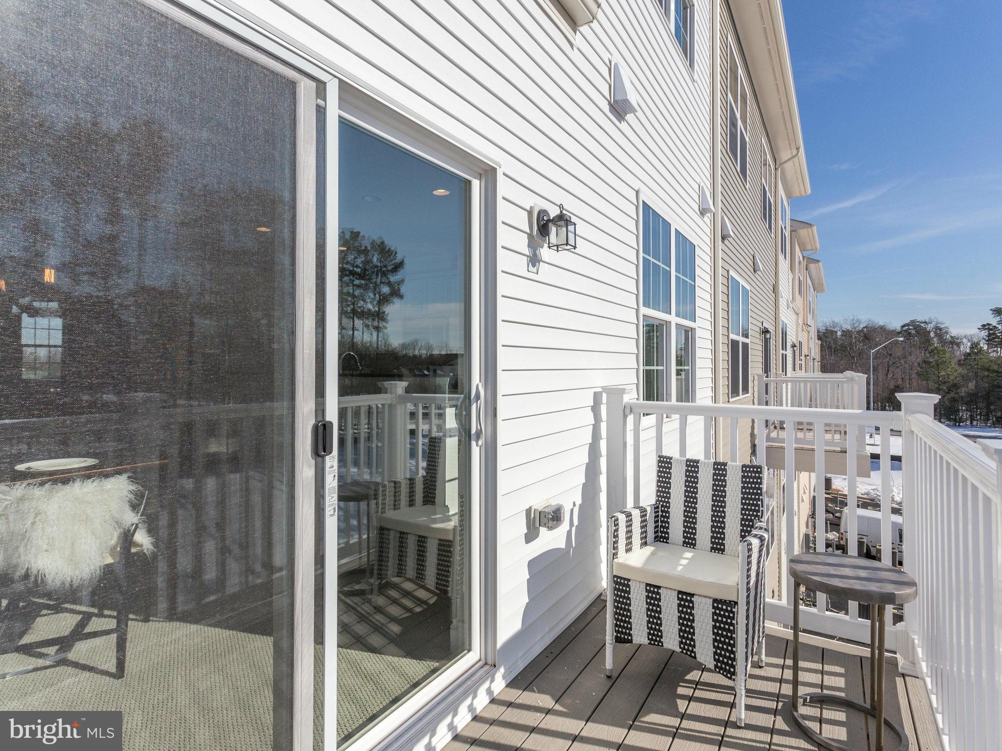 1709 Fieldstone Court Hanover, MD 21076 - Photo 19 of 19 a view of a balcony with a dining table and chairs