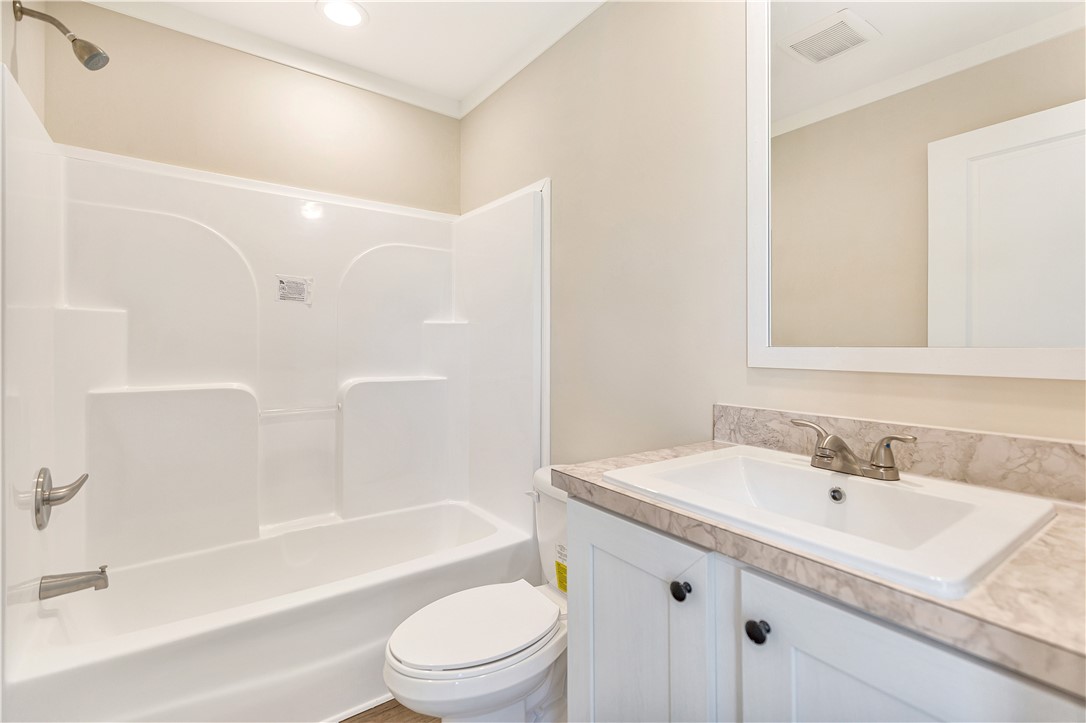 205 Wade Farm Road Fair Play, SC 29643 - Photo 20 of 23 Clean lines and a crisp white vanity define this functional bathroom space.