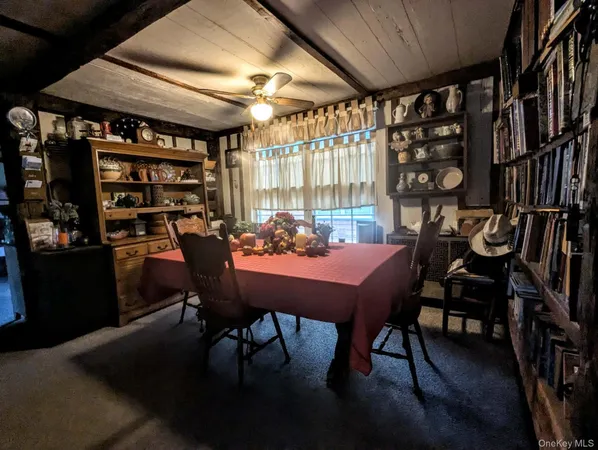 a view of a dining room with furniture and window