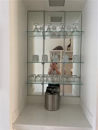 a kitchen with a stove top oven and refrigerator