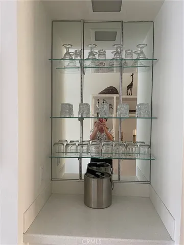 a kitchen with a stove top oven and refrigerator