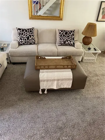 a living room with furniture and a couch