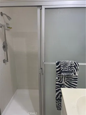 a bathroom with a bathtub and shower