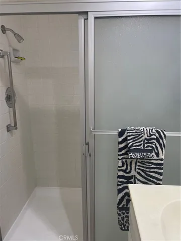a bathroom with a bathtub and shower