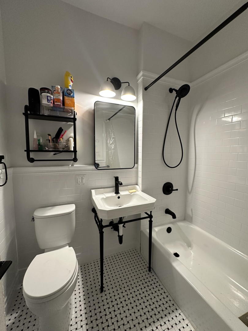 3339 West Adams Street, Unit 3E Chicago, IL 60624 - Photo 4 of 9 a bathroom with a toilet sink shower and mirror