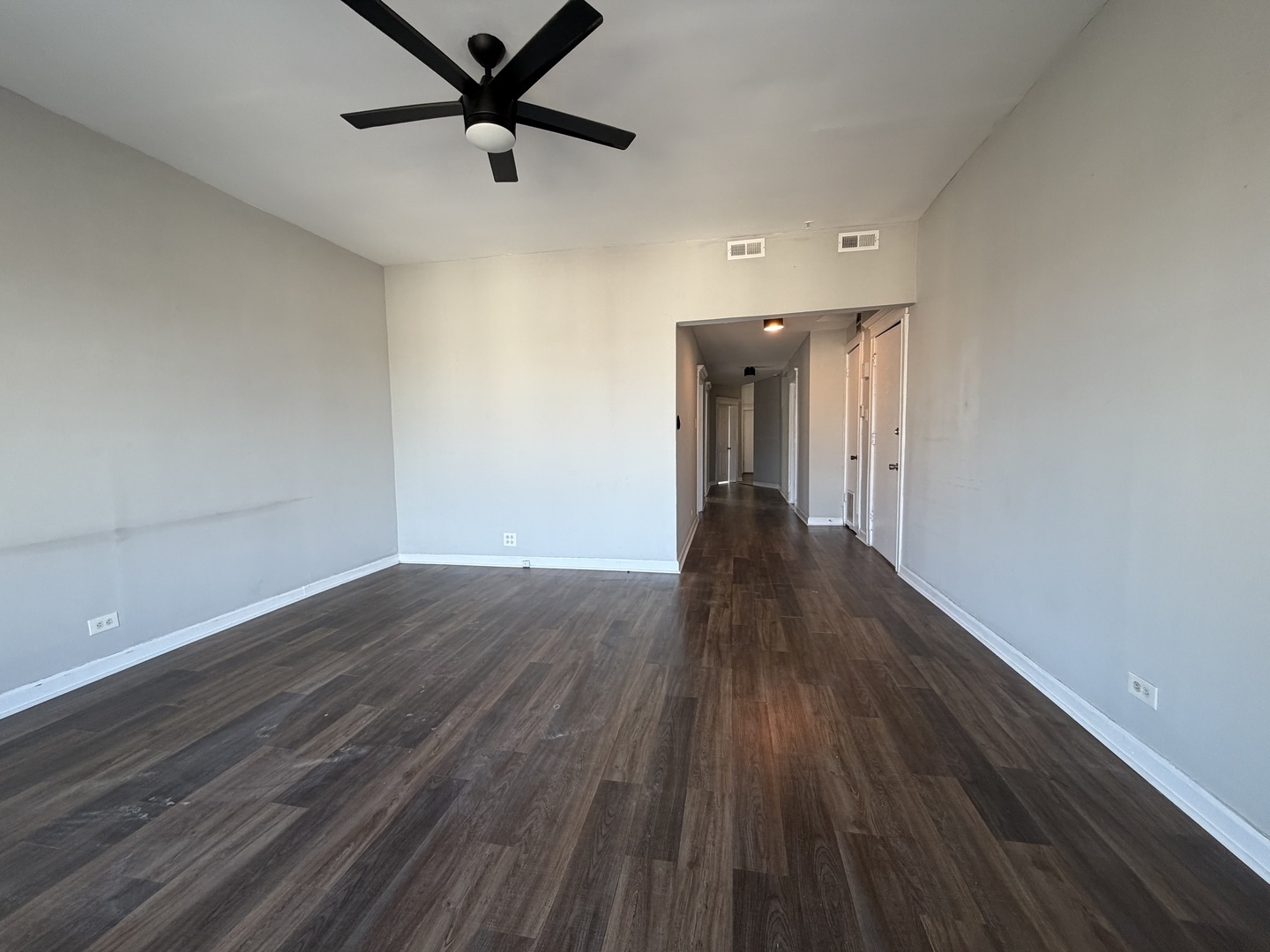 3339 West Adams Street, Unit 3E Chicago, IL 60624 - Photo 9 of 9 a view of a hallway with wooden floor