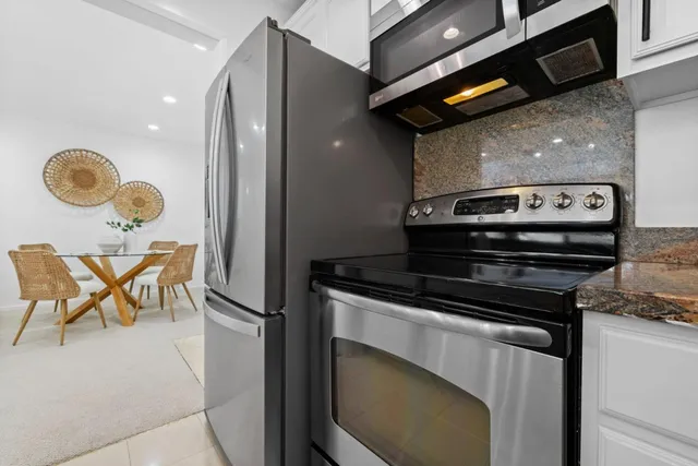a kitchen with a stove and a microwave