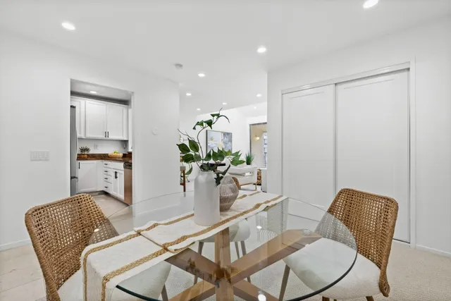 a dining room with furniture and wooden floor