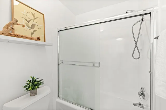 a bathroom with a shower and a shower