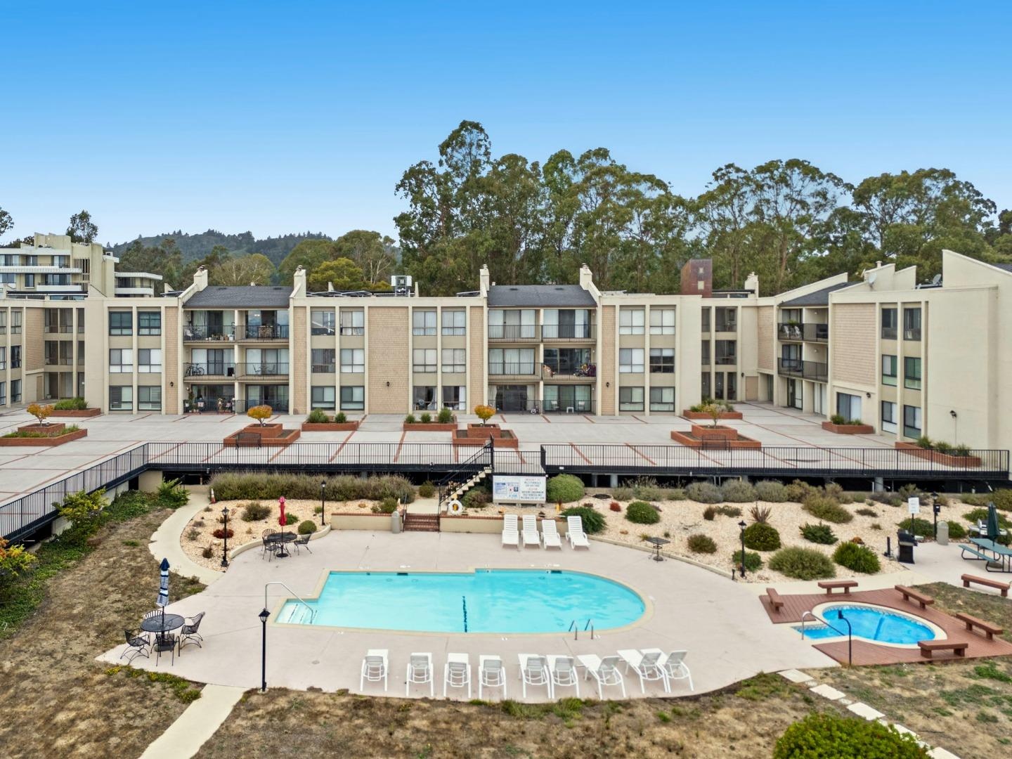 380 Vallejo Drive, Unit 321 Millbrae, CA 94030 - Photo 32 of 38 a view of a swimming pool with an outdoor seating