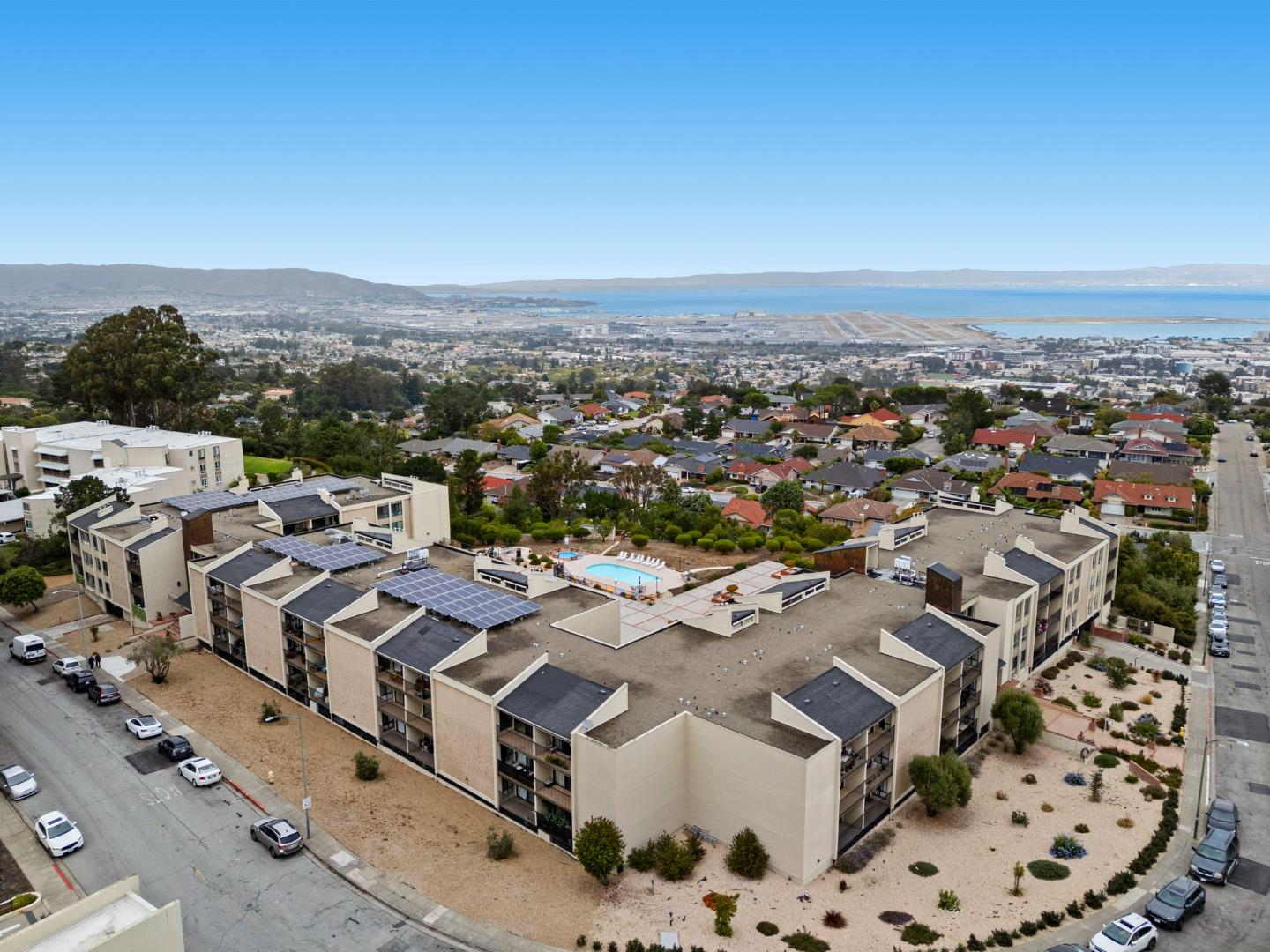 380 Vallejo Drive, Unit 321 Millbrae, CA 94030 - Photo 36 of 38 an aerial view of residential houses with outdoor space